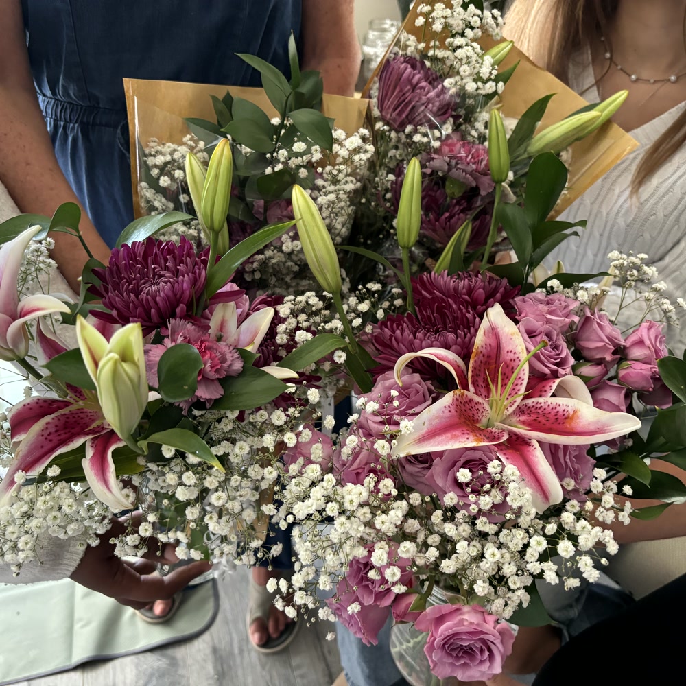 Guests holding their finished bouquets together